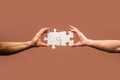 Hand connecting jigsaw puzzle. Business solutions, success and strategy concept. Man hands connecting couple puzzle Royalty Free Stock Photo