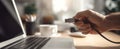 The hand connecting a USB cable to a laptop in a cozy workspace. AI generated image Royalty Free Stock Photo