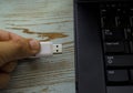 Hand connecting usb flash drive to laptop Royalty Free Stock Photo