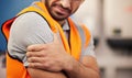 Hand, construction worker and arm pain from building, handyman injury or maintenance stress. Sad, safety and a person