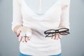 Hand contact lens and case with glasses Royalty Free Stock Photo