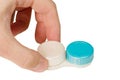 Hand and a contact lens container Royalty Free Stock Photo