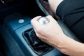 Hand with manual gear in manual transmission car