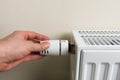 Hand controls thermostatic knob of heating radiator