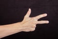 Hand counts three, three fingers outstretched, sign for three