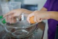 Hand Cracking an Egg into a Bowl. Cooking at home