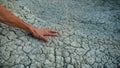 Hand on Cracks On Dry Ground Royalty Free Stock Photo