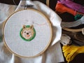 Hand craft embroidery art woman hobby shiba dog flower pattern handmade selected focus Royalty Free Stock Photo