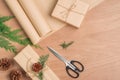 Hand crafted Christmas present gifts box and tools on wooden background Royalty Free Stock Photo