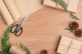 Hand crafted Christmas present gifts box and tools on wooden background Royalty Free Stock Photo