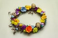 Hand crafted Easter wicker wreath with quail eggs and handmade flowers. Birch branches, polka dot satin ribbon. Stay at home
