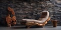 Hand-crafted unique lounge chair made from solid wood log near stone paneling and stucco wall. Rustic interior design