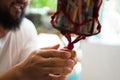 Hands of a craftsman knitting handmade macrame. Royalty Free Stock Photo