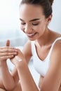 Hand Cream. Beautiful Girl Applying Cream On Hands Skin