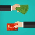 Hand with credit card and hand with cash. Royalty Free Stock Photo