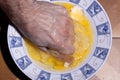 Hand Crushing Egg Yolk