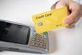 Hand of customer paying with contactless credit card with NFC technology. Royalty Free Stock Photo