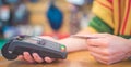 Hand of customer paying with contactless credit card. Payment by Credit Card. Royalty Free Stock Photo
