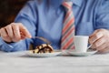 hand cutting homemade caramel custard cake on white plate. On wooden table Royalty Free Stock Photo