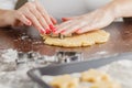 Hand Cutting Out Shapes from Rolled Out Ginger Cookies Dough wit Royalty Free Stock Photo