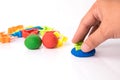 Hand cutting play dough via plastic block Royalty Free Stock Photo