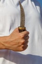 Hand with a dagger knife Royalty Free Stock Photo