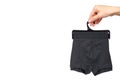 Hand with dark boxer underwear, cotton pants Royalty Free Stock Photo