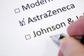 Hand daw in the questionnaire. Choice of vaccine: Comirnaty/Pfizer-BioNTech, AstraZeneca, Moderna, Johnson&Johnson. A closeup of