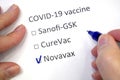 Hand daw in the questionnaire. Choice of vaccine: Sanofi-GSK, CureVac, Novavax. A closeup of female hand answering about a covid-