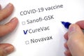 Hand daw in the questionnaire. Choice of vaccine: Sanofi-GSK, CureVac, Novavax. A closeup of female hand answering about a covid-