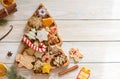 Hand decorated christmas cookies in christmas tree shaped bowl