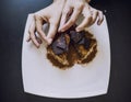 Hand decorated with women`s beautiful chocolate cake closeup Royalty Free Stock Photo