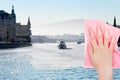 Hand deletes winter Moscow River by pink cloth Royalty Free Stock Photo