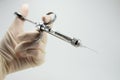 hand dentist doctor with carpool syringe for local anesthesia