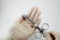 Hand dentist doctor with carpool syringe for local anesthesia on white