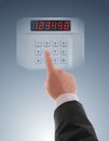 Hand dialling on touch keypad Royalty Free Stock Photo