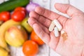 Hand with dietary supplements. Royalty Free Stock Photo