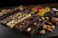 hand-dipped gourmet chocolate bar with assortment of toppings, including toasted nuts and dried fruit