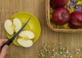 Hand divided apple on plate