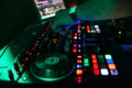 Hand of DJ controlling and moving the mixers in music remote