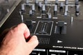 hand on dj mixer crossfader (detail closeup) analog music, super macro, knobs and volume adjusters Royalty Free Stock Photo