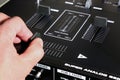 hand on dj mixer crossfader (detail closeup) analog music, super macro, knobs and volume adjusters Royalty Free Stock Photo