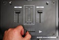 hand on dj mixer crossfader (detail closeup) analog music, super macro, knobs and volume adjusters Royalty Free Stock Photo