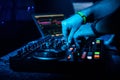 Hand DJ mixing electronic music on a professional controller Royalty Free Stock Photo