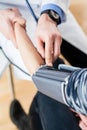 Hand of a doctor measuring the blood pressure of a patient Royalty Free Stock Photo