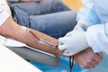 hand of doctor, nurse during blood donation transfusion from man donor in hospital laboratory