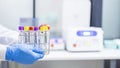 Hand of Doctor or scientist with blue rubber glove inside laboratory investigation unit or blood donation bank in hospital. Royalty Free Stock Photo