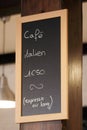 Hand drawing coffee price on blackboard