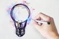 Hand drawing creative light bulb sketch on concrete wall background. Idea and inspiration concept Royalty Free Stock Photo