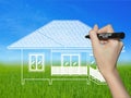 Hand drawing a house on a landscape Royalty Free Stock Photo